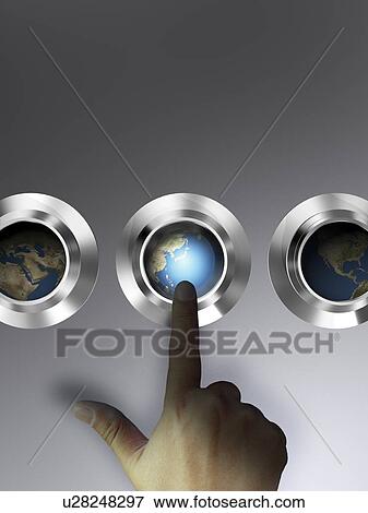 Stock Photo - Human finger pointing at globe showing Asia. Fotosearch