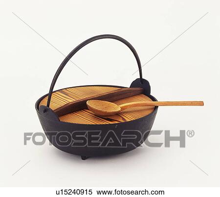 Stock Photography - Iron pot and wooden spoon. Fotosearch