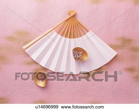 Stock Photo - Japanese fan with gold decorated seashells. Fotosearch