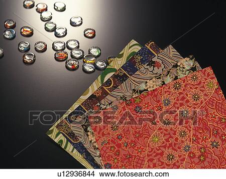 Picture - Japanese paper for origami and Japanese marbles. Fotosearch