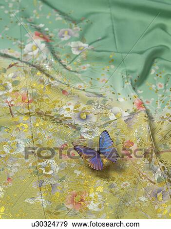 Stock Photo - Kimono fabric and a butterfly figurine. Fotosearch