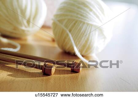 Stock Photo - Knitting needles and balls of wool. Fotosearch