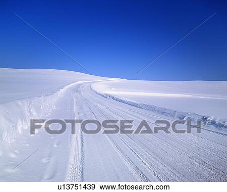 Stock Photo - Landscape and road covered in snow. Fotosearch