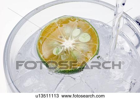 Stock Image - Lime drink on ice. Fotosearch