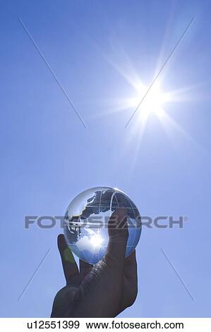Man holding glass globe View Large Photo Image Stock Photo - Man holding glass globe. Fotosearch