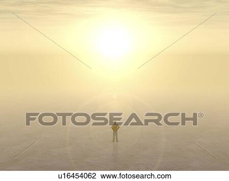 Stock Image - Man standing in desert. Fotosearch