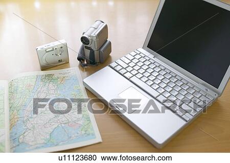 Map, laptop, digital camera and camcorder View Large Photo Image Stock Image - Map, laptop, digital camera and camcorder. Fotosearch