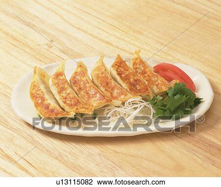 Meat and vegetable dumplings on a plate View Large Photo Image Stock Image - Meat and vegetable dumplings on a plate. Fotosearch