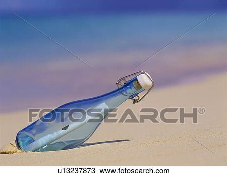 Message in a bottle washed up on the beach View Large Photo Image Stock Image - Message in a bottle washed up on the beach. Fotosearch