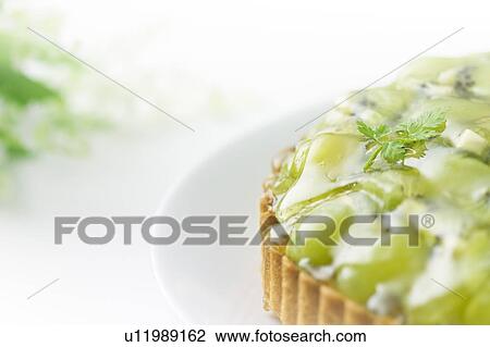 Muscat grape and kiwi tart on plate, close up, white background View Large Photo Image Stock Image - Muscat grape and kiwi tart on plate, close up, white background. Fotosearch