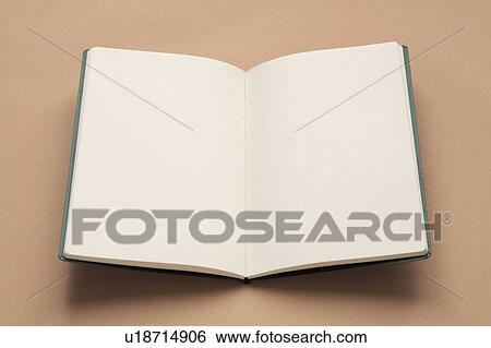 Stock Photograph - Opened new notebook, colored background, copy space. Fotosearch