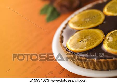 Orange tart on plate, colored background View Large Photo Image Stock Image - Orange tart on plate, colored background. Fotosearch