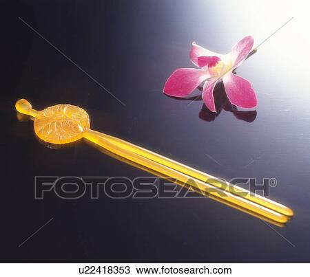Ornamental hairpin and a flower View Large Photo Image Stock Image - Ornamental hairpin and a flower. Fotosearch