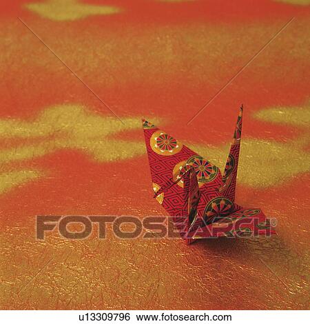 Paper crane on gold and red background View Large Photo Image Stock Photograph - Paper crane on gold and red background. Fotosearch