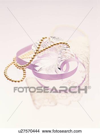 Pearl necklace and purple ribbon View Large Photo Image Picture - Pearl necklace and purple ribbon . Fotosearch