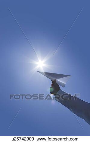 Person holding paper airplane View Large Photo Image Stock Photo - Person holding paper airplane. Fotosearch