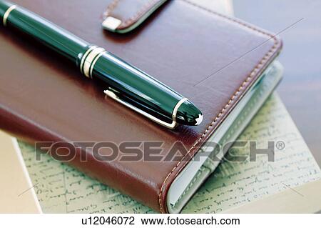 Personal organizer and fountain pen View Large Photo Image Stock Image - Personal organizer and fountain pen. Fotosearch