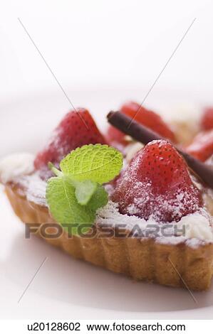 Piece of strawberry tart on plate, close up, white background View Large Photo Image Stock Image - Piece of strawberry tart on plate, close up, white background. Fotosearch