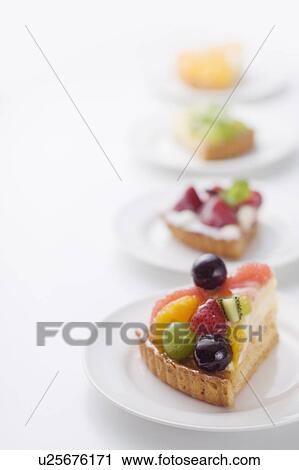 Pieces of tart on plates, white background View Large Photo Image Stock Image - Pieces of tart on plates, white background. Fotosearch