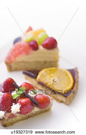 Stock Photo - Pieces of tart, white background. Fotosearch