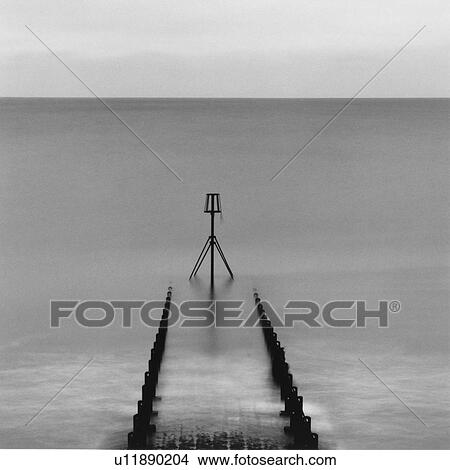 Picture - Pier leading into the sea. Fotosearch