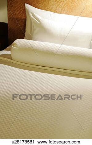 Stock Image - Pillows and bedspread. Fotosearch