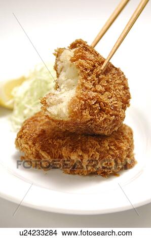 Picture - Plate of fried croquettes, close up, white background. Fotosearch