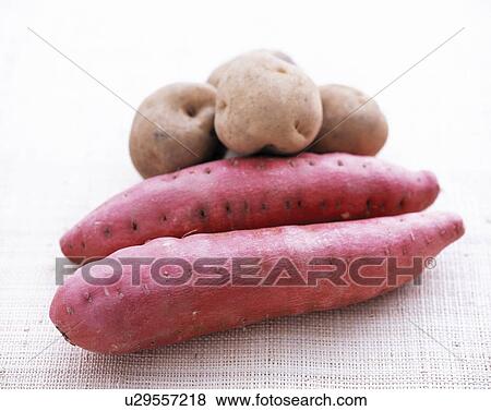 Potatoes and Sweet Potatoes View Large Photo Image Stock Photo - Potatoes and Sweet Potatoes. Fotosearch