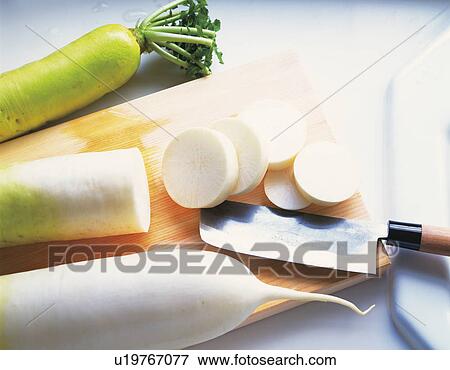 Radish on a cutting board View Large Photo Image Stock Photo - Radish on a cutting board. Fotosearch
