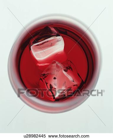 Red liqueur in a cocktail glass View Large Photo Image Stock Photography - Red liqueur in a cocktail glass. Fotosearch