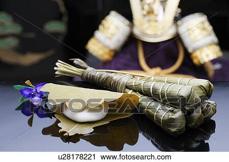 Stock Image - Rice cake wrapped in bamboo leaves. Fotosearch