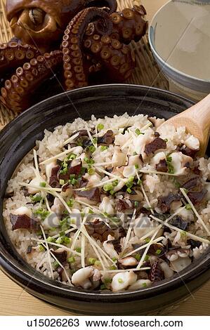 Stock Image - Rice cooked with slices of octopus. Fotosearch