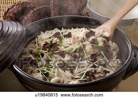 Stock Photography - Rice cooked with slices of octopus, close up. Fotosearch