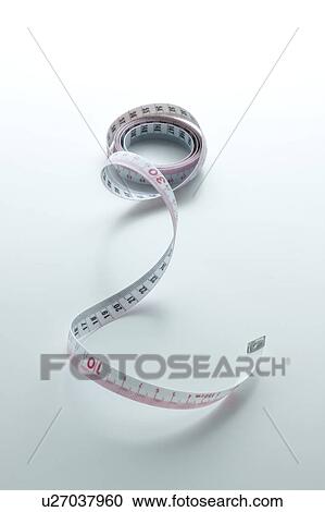 Stock Image - Rolled Tape Measure. Fotosearch