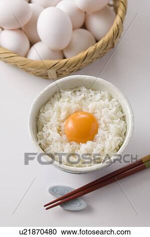 Row egg on bowl of rice, white background View Large Photo Image Stock Image - Row egg on bowl of rice, white background. Fotosearch