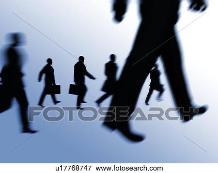 Silhouetted business people walking View Large Photo Image Stock Photo - Silhouetted business people walking. Fotosearch