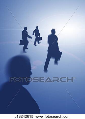 Silhouetted business people walking towards light View Large Photo Image Stock Photography - Silhouetted business people walking towards light. Fotosearch