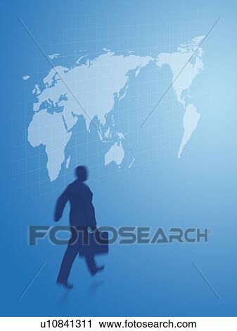 Stock Image - Silhouetted businessman walking in front of world map. Fotosearch