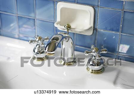Stock Photo - Sink and faucet in bathroom. Fotosearch