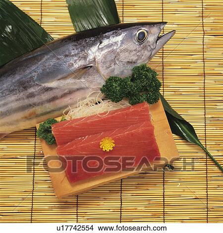 Picture - Sliced bonito and a whole bonito. Fotosearch