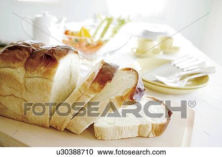 Sliced loaf of bread View Large Photo Image Stock Image - Sliced loaf of bread. Fotosearch