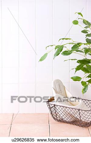 Slippers in basket placed on floor View Large Photo Image Stock Photography - Slippers in basket placed on floor. Fotosearch