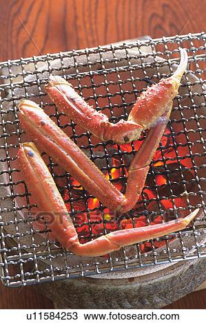 Snow crab legs cooking over hot coal View Large Photo Image Stock Image - Snow crab legs cooking over hot coal. Fotosearch