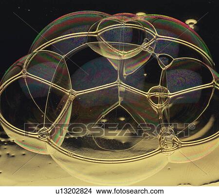 Picture - Soap bubbles sticking together. Fotosearch