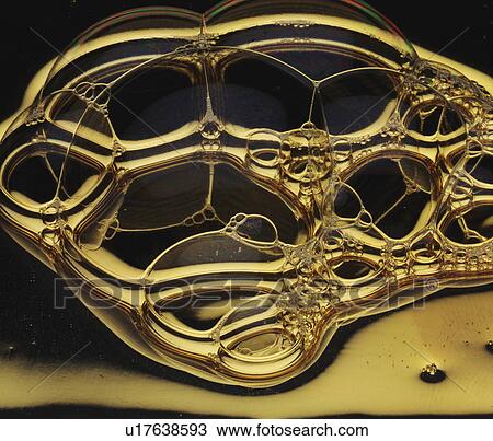 Stock Image - Soap bubbles sticking together. Fotosearch