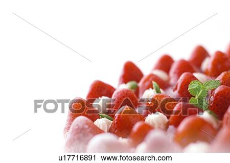 Stock Image - Strawberry tart, close up, white background, copy space. Fotosearch