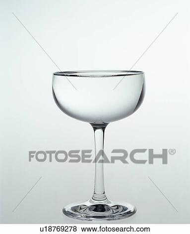 Stock Photo - Studio shot of empty cocktail glass. Fotosearch