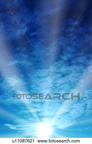 Stock Image - Sunbeams and clouds. Fotosearch