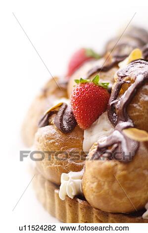 Tart with cream puffs and strawberry, close up, white background View Large Photo Image Stock Image - Tart with cream puffs and strawberry, close up, white background. Fotosearch