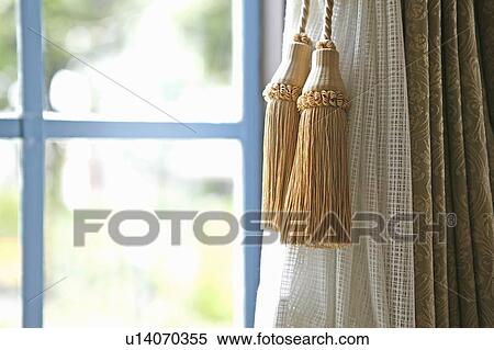 Tasseled curtains and a window View Large Photo Image Stock Photography - Tasseled curtains and a window. Fotosearch